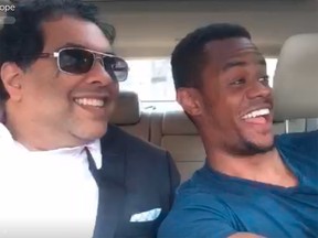 Calgary Mayor Naheed Nenshi poses for a selfie by the driver of a Boston rideshare vehicle in this image from a Periscope video.
