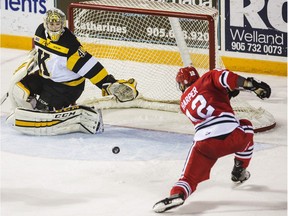 Niagara IceDogs Stephen Harper couldn't get a handle on a bouncing puck, putting the shot onto the pad of Kingston goalie Lucas Peressini.  Niagara ended the series against the Kingston Frontenacs winning their fourth game  Wednesday April 13, 2016  in OHL playoff action at the Meridian Centre in St. Catharines.  .Bob Tymczyszyn/St. Catharines Standard/Postmedia Network