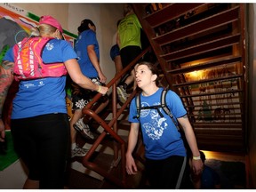 People climb up the stairs at the Calgary Tower during the Climb and Run for Wilderness in Calgary, Alta., on Saturday April 23, 2016.
