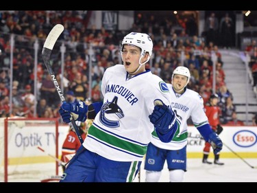 The Vancouver Canucks forward Jake Virtanen celebrates after a goal against the Calgary Flames during hockey action at the Scotiabank Saddledome in Calgary, AB., on Thursday, April 7, 2016. The teams were tied 2-2 at the end of the first period. (Photo by Andy Maxwell Mawji/ Postmedia)