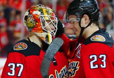 Calgary Flames Joni Ortio and Sean Monahan after their final home game of the season, a 7-3 win over in NHL hockey in Calgary, Alta., on Thursday, April 7, 2016. AL CHAREST/POSTMEDIA