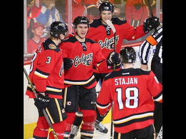 Calgary Flames Mikael Backlund celebrates with teammates after scoring against the Vancouver Canucks during NHL hockey in Calgary, Alta., on Thursday, April 7, 2016. AL CHAREST/POSTMEDIA