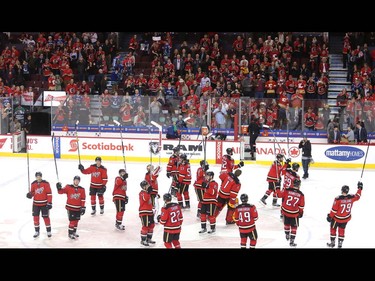 The Calgary Flames salute their fans after their final home game of the year, a 7-3 win over the Vancouver Canucks, at the Saddledome Thursday night April 7, 2016.  (Ted Rhodes/Postmedia)