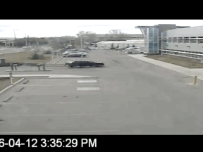 From a video released by the Calgary Police showing an alleged car thief ditching a stolen car in a parking lot that happened to be in front of a Calgary police station. Officers from the district office apprehended the suspect.