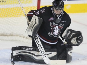 Red Deer Rebels goalie Rylan Toth makes a pad stop during WHL hockey action between the Red Deer Rebels and the Calgary Hitmen at the Scotiabank Saddledome in Calgary, Alta. on Wednesday March 18, 2015. Jim Wells/Calgary Sun/QMI Agency