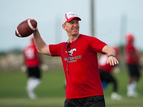 Head Coach Dave Dickenson of the Calgary Stampeders practices during mini camp at IMG Academy  on April 17, 2015 in Bradenton, Florida.