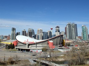 The Saddledome stands out against the Calgary skyline as seen from Scotsman's Hill Wednesday, April 13, 2016. The city has hired a consultant to study future uses for the site.