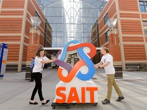 A six foot sculpture of SAIT's new logo is wheeled around SAIT campus in Calgary on Tuesday, April 5, 2016.