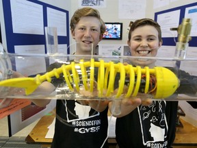 Tim Gubski, Grade 7, left, and Griffin White, Grade 6, students from Westmount Charter School, with their Indestructible Submarine at the Calgary Youth Science Fair in Calgary, Alta., on Friday April 15, 2016.