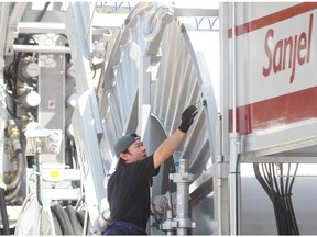 A Sanjel coiled tubing unit is displayed at the 2012 Global Petroleum Show in Calgary. The company's assets are expected to fetch $325 million to $375 million.