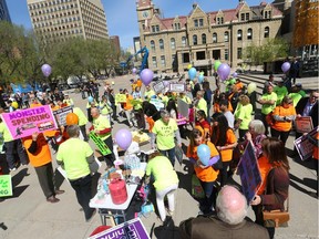 Supporters gather at a rally at City Hall in Calgary, Alta on Wednesday April 20, 2016 and a group of concerned citizens voiced concerns about a bus rapid transit (BRT) line planned for southwest Calgary. Jim Wells//Postmedia