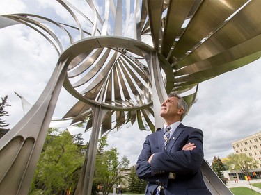 Former astronaut and current chancellor of the school, Dr. Robert Thirsk, eyes a sculpture at the University of Calgary on Thursday, April 28, 2016. The university is celebrating its 50th year.
