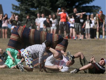 2010 - University of Calgary students participate in a downhill couch race on St Andrews Hill near the University
