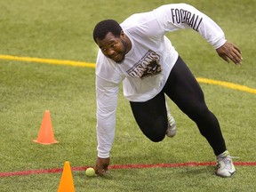 University of Manitoba Bisons defensive tackle David Onyemata runs a drill for NFL scouts in Winnipeg in March. (Brian Donogh)