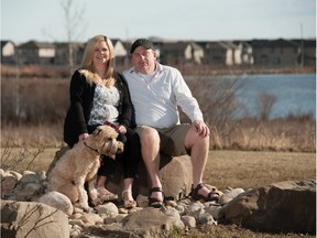 Will Charlton, Shely Henry and their dog Teagan take in the outdoor beauty at Ranchers' Rise in Okotoks.