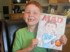 7-year-old TJ Desjarlais poses in Medicine Hat,. Desjarlais is basking in the limelight after being featured in Mad Magazine as a dead ringer for the publication's iconic face Alfred E. Neuman. T
