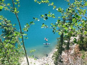 Kayakers on Lake Minnewanka in June 2015. Boats launching on the lake now have to have an inspection for invasive mussels.