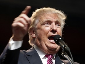 In this photo taken May 5, 2016, Republican presidential candidate Donald Trump speaks in Charleston, W. Va. There's no cheering at the White House for Donald Trump, but his ascent as the presumptive Republican nominee means a few of President Barack Obama's key achievements could be more likely to survive after he leaves office.  (AP Photo/Steve Helber) ORG XMIT: WX106