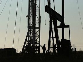 ANDREWS, TX - JANUARY 20: Workers for an oilfield service company work at a drilling site in the Permian Basin oil field on January 20, 2016 in the oil town of Andrews, Texas.