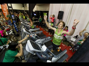 Dave Proctor celebrates setting a world record on a treadmill during the Calgary Marathon Expo at the Big Four Building in Calgary, Alta., on Saturday, May 28, 2016. Seven world records for treadmill running were broken, including Dave Proctor's 24-hour run, all in support of MitoCanada. Lyle Aspinall/Postmedia Network