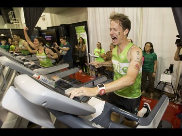 Dave Proctor pounds through the final seconds of his 24-hour treadmill run almost 20 minutes after setting a world record during the Calgary Marathon Expo at the Big Four Building in Calgary, Alta., on Saturday, May 28, 2016. Seven world records for treadmill running were broken, including Dave Proctor's 24-hour run, all in support of MitoCanada. Lyle Aspinall/Postmedia Network