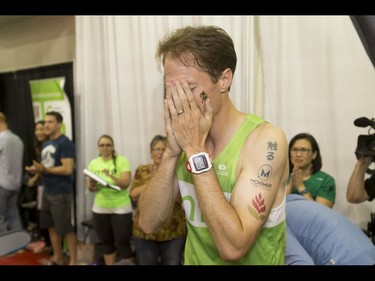 Dave Proctor breaks down at the end of his 24-hour treadmill run almost 20 minutes after setting a world record during the Calgary Marathon Expo at the Big Four Building in Calgary, Alta., on Saturday, May 28, 2016. Seven world records for treadmill running were broken, including Dave Proctor's 24-hour run, all in support of MitoCanada. Lyle Aspinall/Postmedia Network