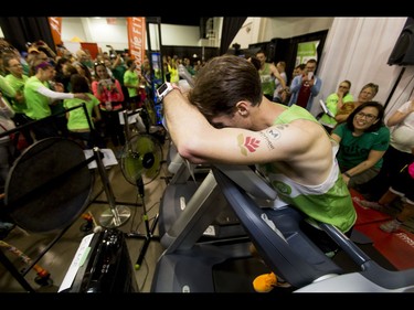 Dave Proctor breaks down at the end of his 24-hour treadmill run almost 20 minutes after setting a world record during the Calgary Marathon Expo at the Big Four Building in Calgary, Alta., on Saturday, May 28, 2016. Seven world records for treadmill running were broken, including Dave Proctor's 24-hour run, all in support of MitoCanada. Lyle Aspinall/Postmedia Network