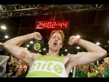 Dave Proctor celebrates his 24-hour treadmill world-record treadmill run during the Calgary Marathon Expo at the Big Four Building in Calgary, Alta., on Saturday, May 28, 2016. Seven world records for treadmill running were broken, including Dave Proctor's 24-hour run, all in support of MitoCanada. Lyle Aspinall/Postmedia Network