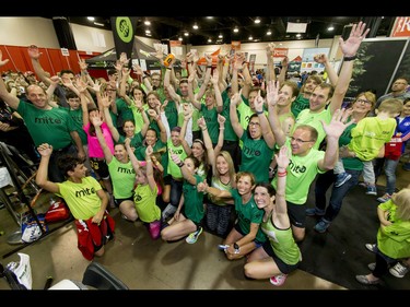 Team MitoCanada celebrates after one of their own, Dave Proctor, set a world record in a 24-hour treadmill run during the Calgary Marathon Expo at the Big Four Building in Calgary, Alta., on Saturday, May 28, 2016. Seven world records for treadmill running were broken, including Dave Proctor's 24-hour run, all in support of MitoCanada. Lyle Aspinall/Postmedia Network