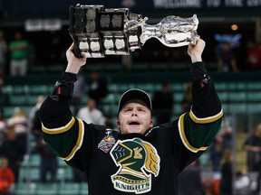 RED DEER, AB - MAY 29:  Max Jones #49 of the London Knights (OHL) hoists the Memorial Cup after defeating the Rouyn-Noranda Huskies (QMJHL) during the Memorial Cup Final on May 29, 2016 at the Enmax Centrium in Red Deer, Alberta, Canada.