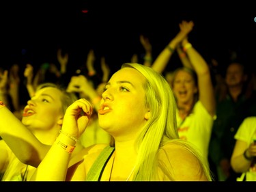 Fans sing along with Jacob Hoggard, lead singer of Hedley, at the Scotiabank Saddledome in Calgary, Ab., on Friday May 13, 2016. Mike Drew/Postmedia