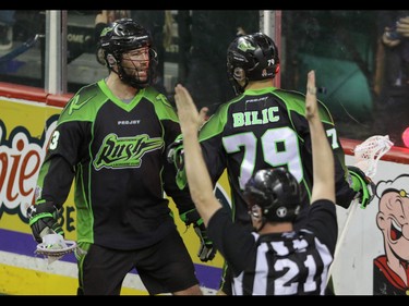 Saskatchewan Rush John LaFontaine and Nik Bilic celebrate another goal against the Calgary Roughnecks in NLL action at the Scotiabank Saddledome in Calgary, Alta. on Saturday, May 14, 2016. The Rush beat the Roughnecks 16-10. Mike Drew/Postmedia