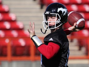 Quarterback Andrew Buckley lines up to throw a pass during the opening day of the Calgary Stampeders training camp at McMahon Stadium on Sunday May 29, 2016.