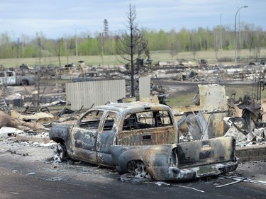 A burned out pickup truck is shown during a media tour of the fire-damaged city of Fort McMurray, Alta. on Monday, May 9, 2016.