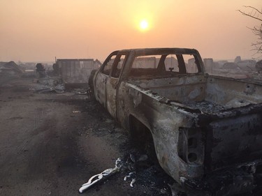 A burned-out truck in the Beacon Hill area of Fort McMurray, Alta. is shown on Wednesday, May 4, 2016.