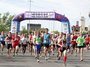 FILE PHOTO: A huge group of runners and walkers bolt from the start line at during the 2016 Sport Chek Mother's Day Run, Walk and Ride in Calgary, Alta on Sunday May 8, 2016. The event attracted thousands of participants who jammed the Chinook Centre parking lot. Jim Wells//Postmedia
