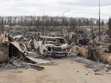 Damage from the wildfires is seen in the Beacon Hill neighbourhood in Fort McMurray, Alta., on Monday, May 9, 2016.
