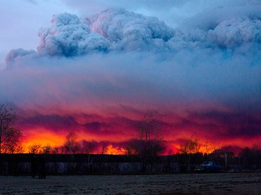 A wildfire moves towards the town of Anzac from Fort McMurray on Wednesday, May 4, 2016. The wildfire has already torched 1,600 structures in the evacuated oil hub of Fort McMurray and is poised to renew its attack in another day of scorching heat and strong winds.