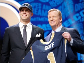 CHICAGO, IL - APRIL 28:  (L-R) Jared Goff of the California Golden Bears holds up a jersey with NFL Commissioner Roger Goodell after being picked #1 overall by the Los Angeles Rams during the first round of the 2016 NFL Draft at the Auditorium Theatre of Roosevelt University on April 28, 2016 in Chicago, Illinois.