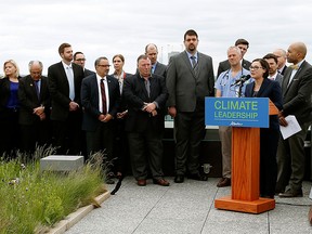 Shannon Phillips introduced Bill 20, the Climate Leadership Implementation Act, on the roof of the Federal Building in Edmonton on May 24, 2016.