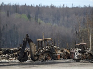 Burned out construction equipment is shown during a media tour of the fire-damaged city of Fort McMurray, Alta. on Monday, May 9, 2016.