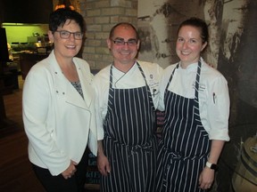 Cal 0514 Hyatt 2 All smiles at  the media launch of Thomsons'  new spring menu held May 5 are Hyatt GM Amy Johnson with executive chef David Flegel and chef de cuisine Rebecca House. This day happened to coincide with the 16-year anniversary of the opening of the Hyatt Regency, Calgary.