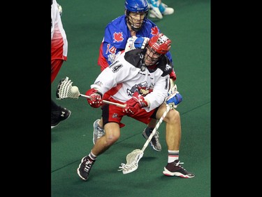 The Calgary Roughnecks' Berg Wesley and the Toronto Rock's  goalie Rob Marshall tangle during National Lacrosse league action at the Scotiabank Saddledome on Saturday, April 30, 2016.