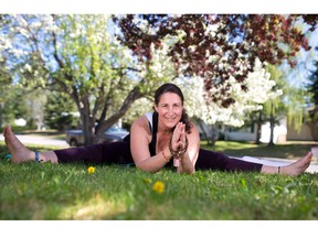 Yoga Instructor Johanna Steinfeld demonstrates the upavista konasana (wide legged seated pose)