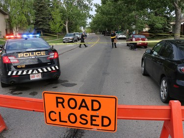 Police investigate in the 4000 block of Whitehorn Drive where an arrest was made in an early morning homicide that had occurred earlier on nearby Rundlehorn Drive.