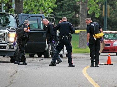 Police investigate in the 4000 block of Whitehorn Drive where an arrest was made in an early morning homicide that had occurred earlier on nearby Rundlehorn Drive.