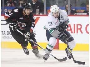 CALGARY, AB. NOVEMBER 1, 2015  -- Carsen Twarynski of the Calgary Hitmen chases down Mathew Barzal of the Seattle Thunderbirds in WHL action at the Saddledome Sunday November 1, 2015. (Ted Rhodes/Calgary Herald) For Sports story by Laurence Heinen. Trax # 00069716A