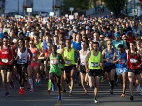 Runners break from the starting line for the Calgary Marathon at the Stampede Grounds in Calgary, Alta., on Sunday, May 29, 2016. There were 5k, 10k, 21.1k, 42.2k and 50k distances in the race, including the half-marathon national championships. Lyle Aspinall/Postmedia Network