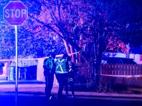 Calgary Police traffic investigators at the scene of a fatal collision where a child died at 79 st and 47 ave NW in Calgary, Ab., on Friday May 6, 2016. Mike Drew/Postmedia