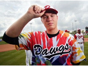 Outfielder Daniel Fredrickson wears the new tie dye Okotoks Dawgs  jersey during the annual media day at Seaman Stadium Friday May 27, 2016.  Fredrickson, Fredrickson, from Woodinville, Wash., is back for his second season with the Dawgs after winning the Western Major Baseball League's hitting crown last year.